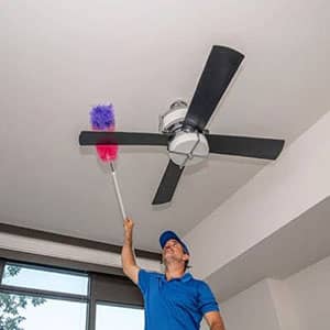 worker Cleaning Ceiling fan